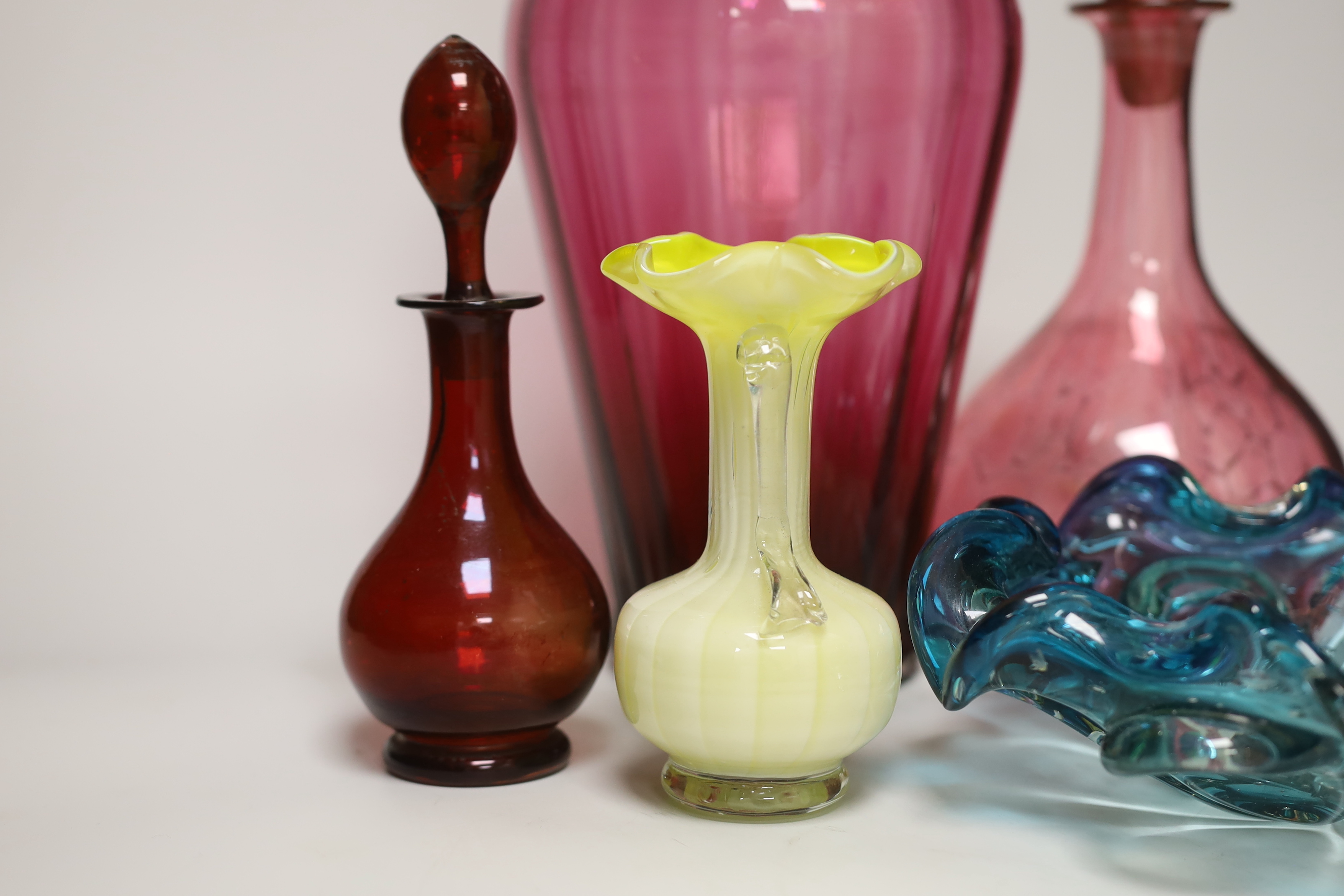 A cranberry vase, decanter and mixed glassware, tallest 34cm